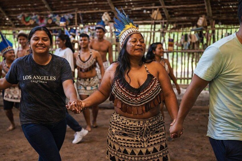 Cultural welcome: sharing a traditional dance with members of an Amazon native community. 1