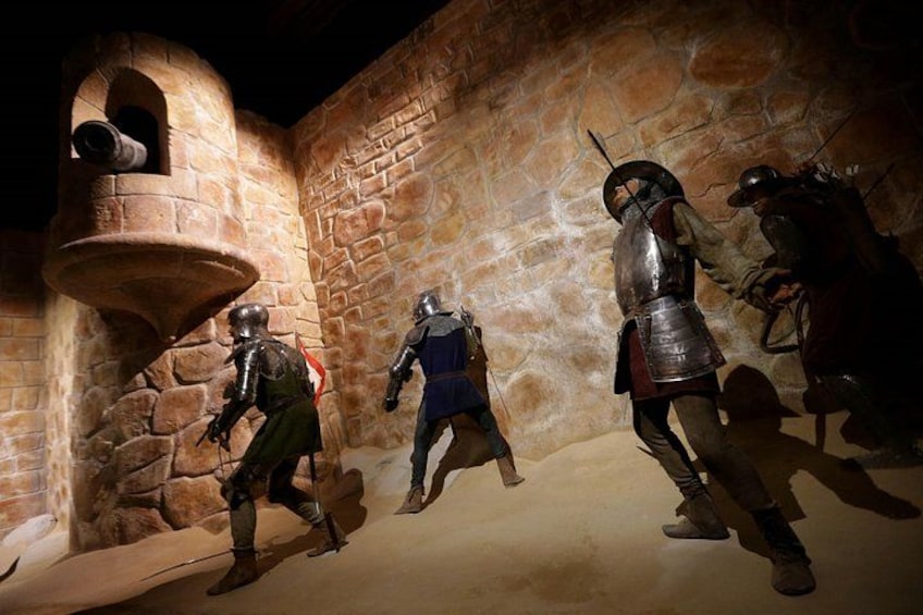 Medieval armor, stone walls, and a bell tower. 4