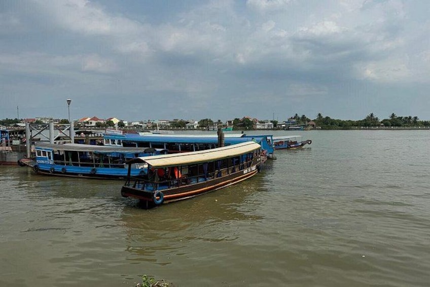 A river with boats docked along the shore. 5