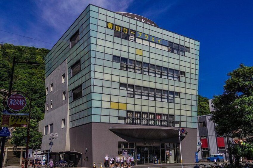 A modern building with a glass facade and signage in a foreign language. 3