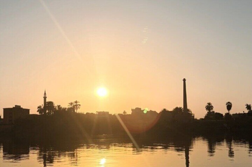 Luxor sunset sailboat smile 3