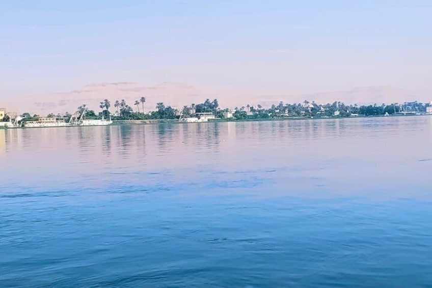 Luxor sunset sailboat smile 4