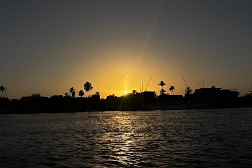 Luxor sunset sailboat smile 5
