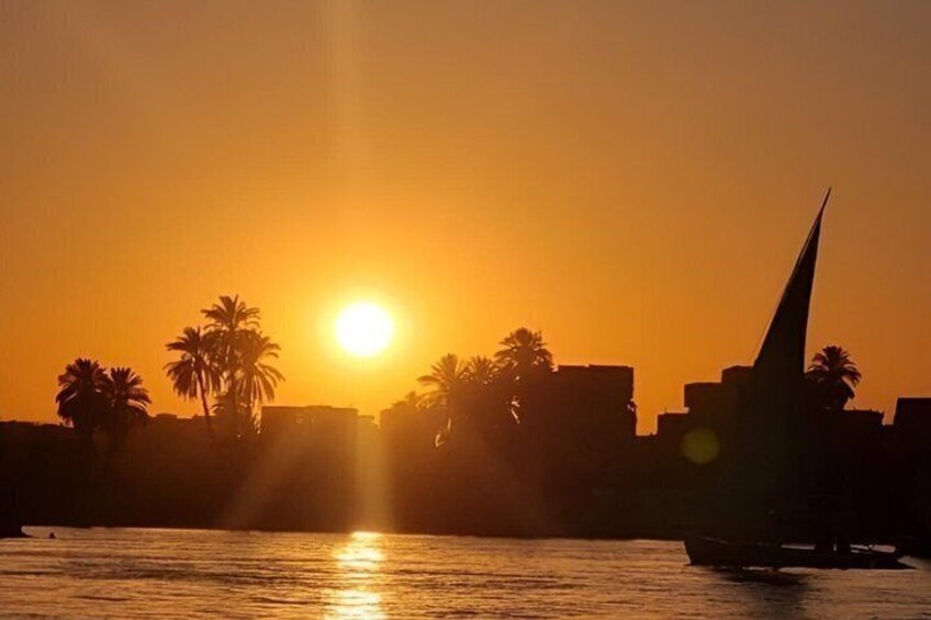 Luxor sunset sailboat smile 2