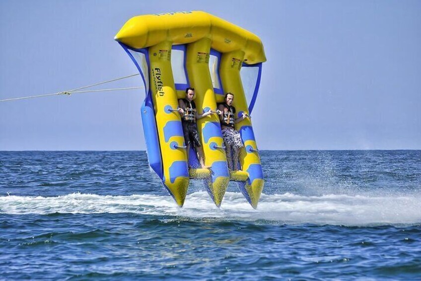 A person parasailing over the ocean. 4