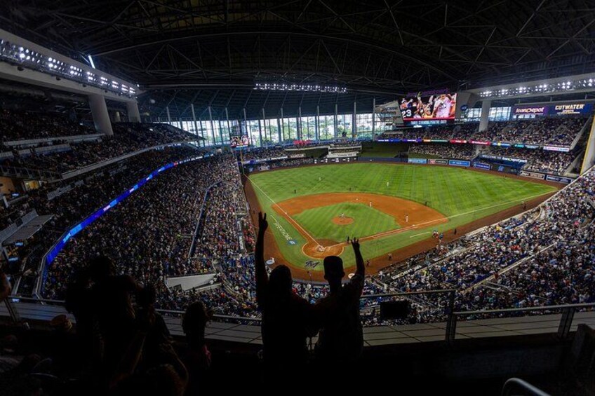 A baseball stadium filled with spectators. 1