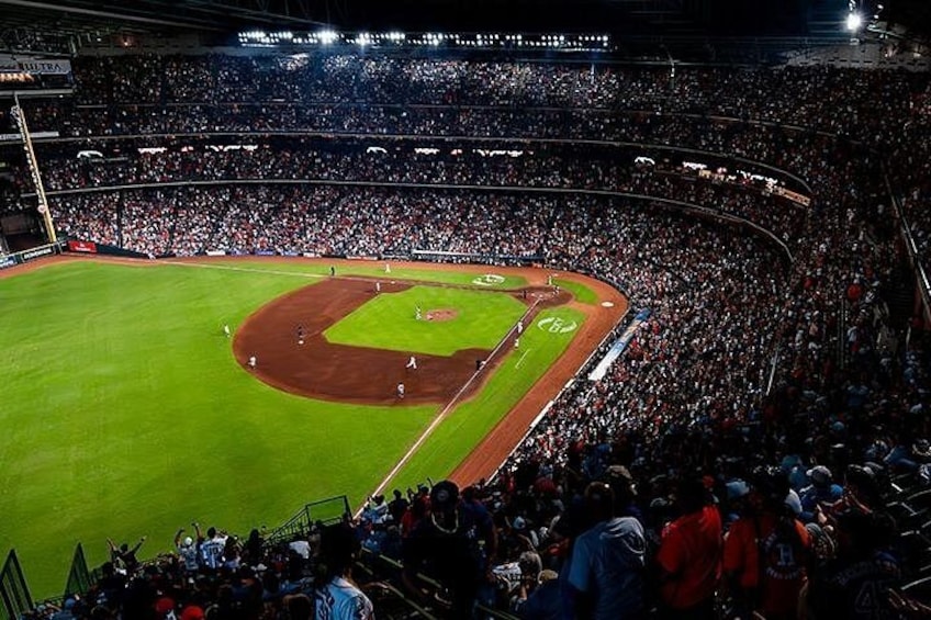 A baseball stadium filled with spectators. 2