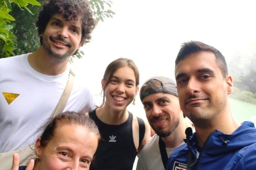 A group of people outdoors, possibly on a hike or a nature walk. 2
