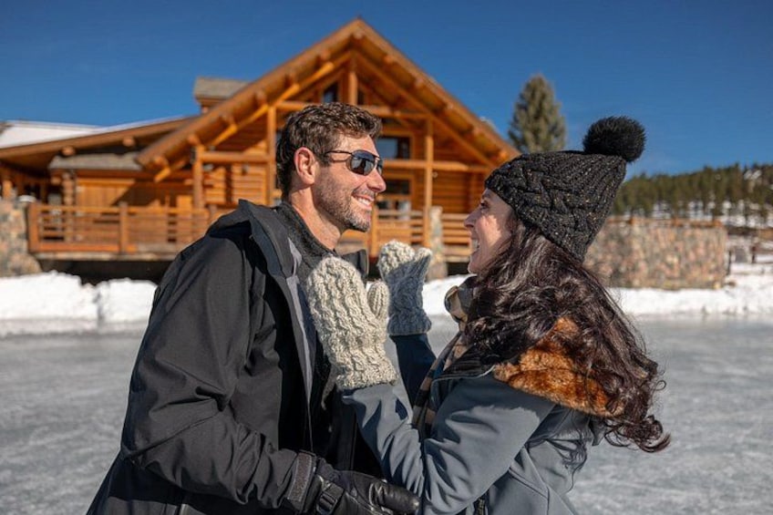 A wooden cabin with a snow-covered ground in the background. 5