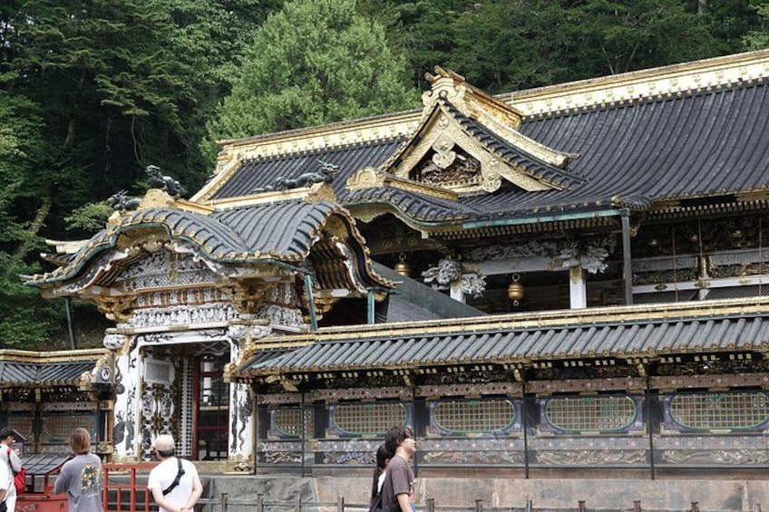 A traditional Japanese temple with ornate architecture, including curved roofs and intricate decorations. 3