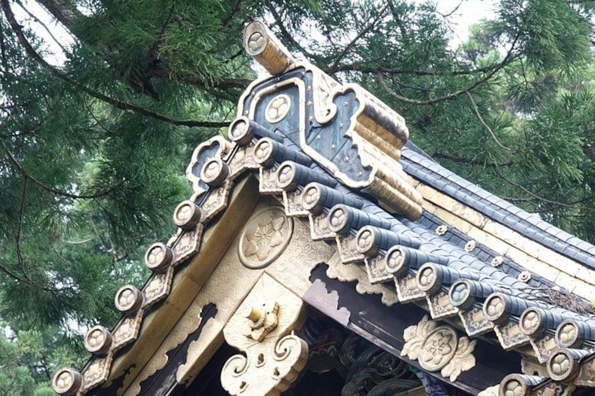 A traditional building with ornate roof tiles and intricate carvings. 4