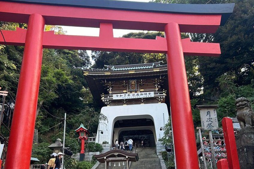 A traditional Japanese torii gate, a shrine entrance, and a pagoda with a red roof. 5