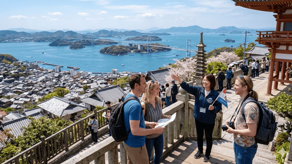 A scenic overlook with traditional architecture, a bridge, and a view of a coastal town. 1