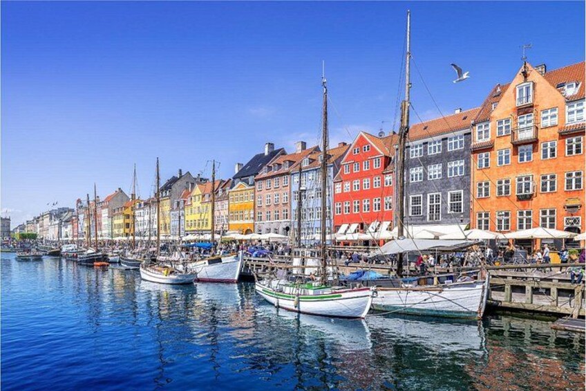 A harbor with colorful buildings and boats. 4