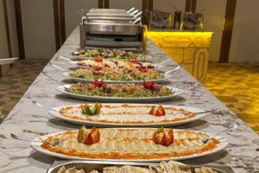 A buffet table with various dishes. 4