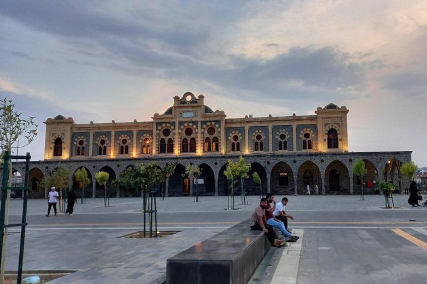 A historic building with arches and a courtyard. 4