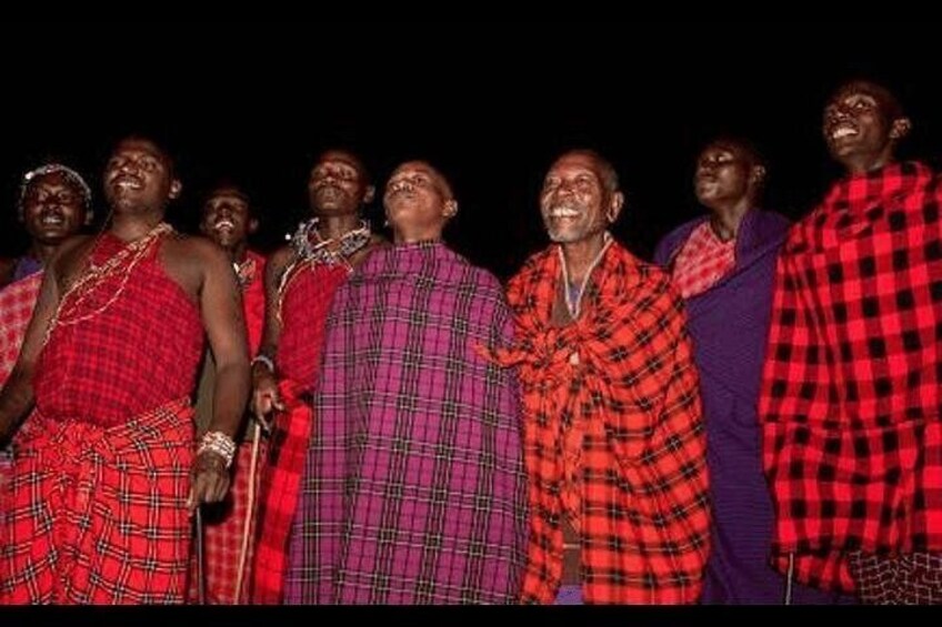 A group of people in traditional attire standing together. 5