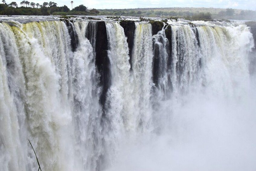 A large waterfall with multiple tiers of water cascading down. 5