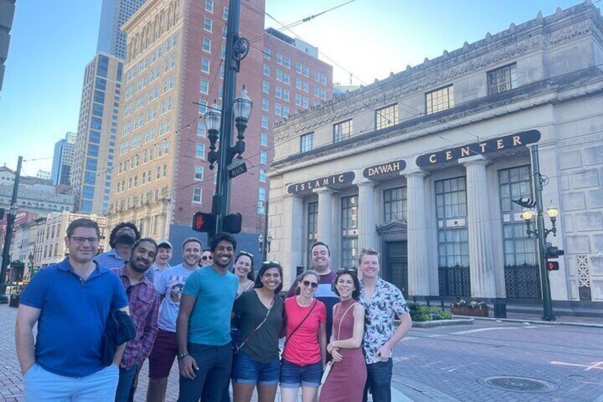 A group of people posing in front of the Islamic Center building. 3