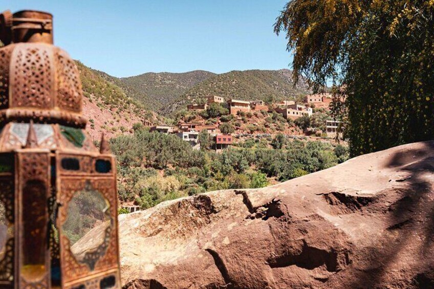 A mountainous village with traditional buildings and a large, ornate structure in the foreground. 4