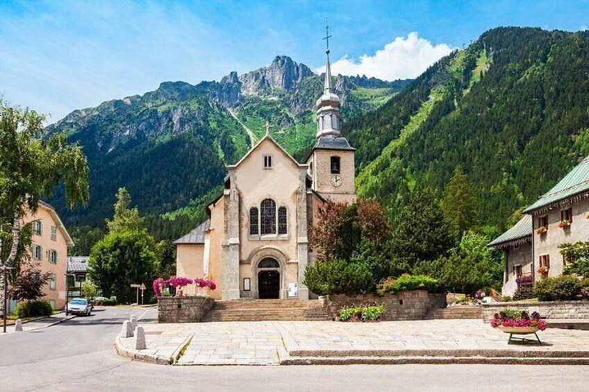 St. Michael's Church: The bell tower typical of Savoyard Baroque art, facing the mountains. 3