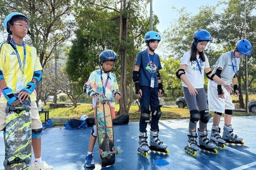 People rollerblading on a blue track. 3
