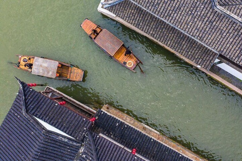 A dock with several boats and a waterway. 1