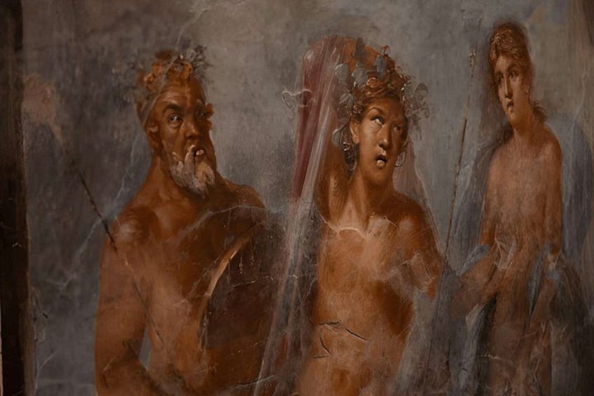 A fresco with three figures, one with a beard and two with veils. 4
