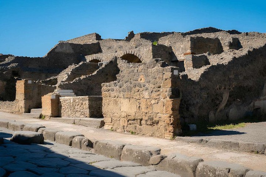 Ancient ruins with stone structures and arches. 3
