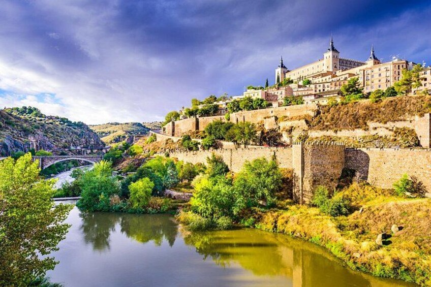 A river, a bridge, and a castle on a hill. 1