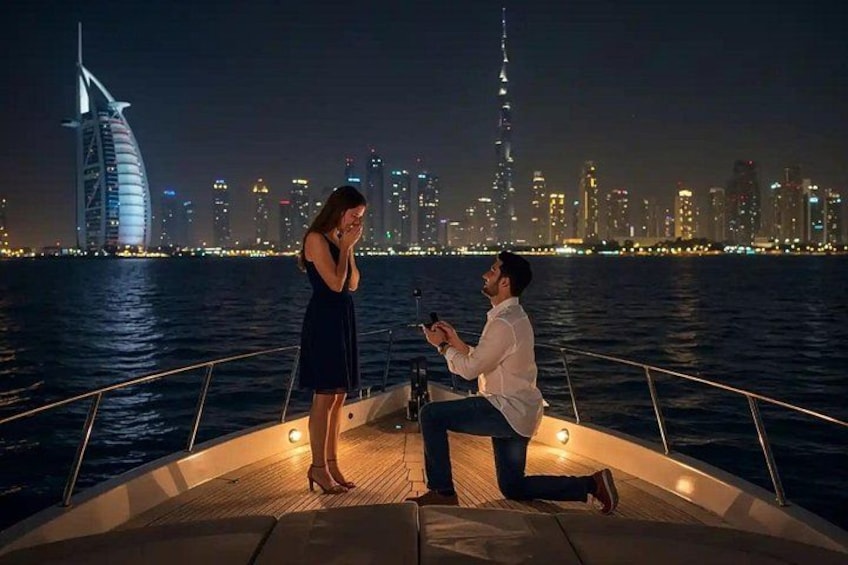A man proposing to a woman on a boat with a city skyline in the background. 3