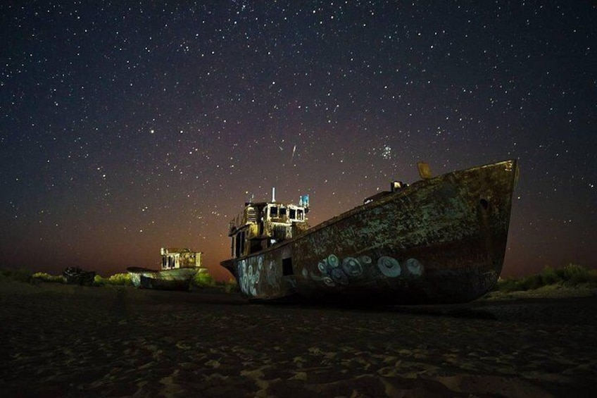 A shipwreck at night with stars in the sky. 3