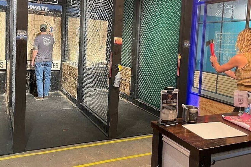 A person painting a window inside a building. 5