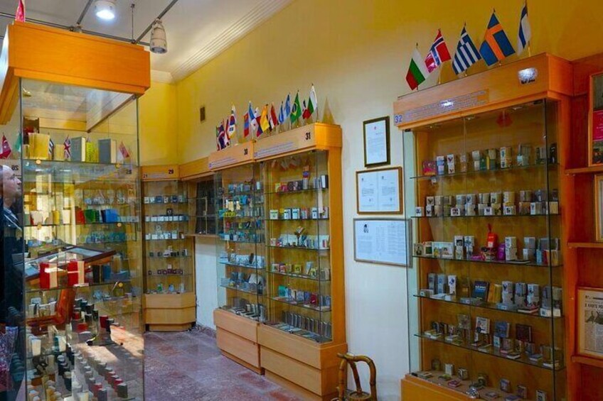 A bookstore with glass display cases filled with books and postcards. 4