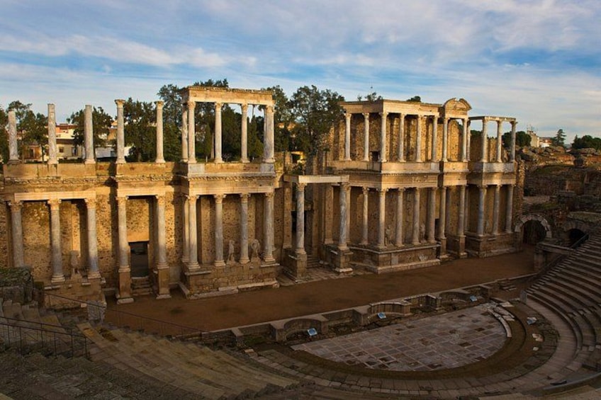 Ancient ruins with columns and a theater. 2