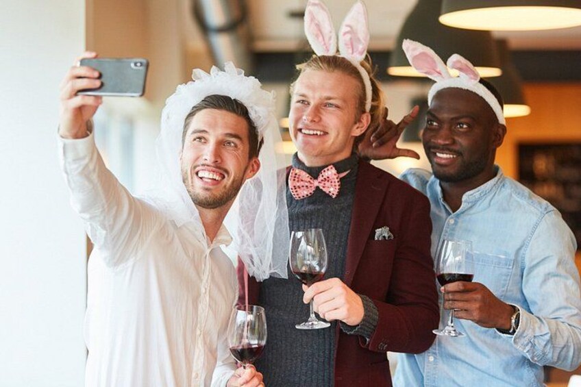 Three people wearing bunny ears and taking a selfie. 3