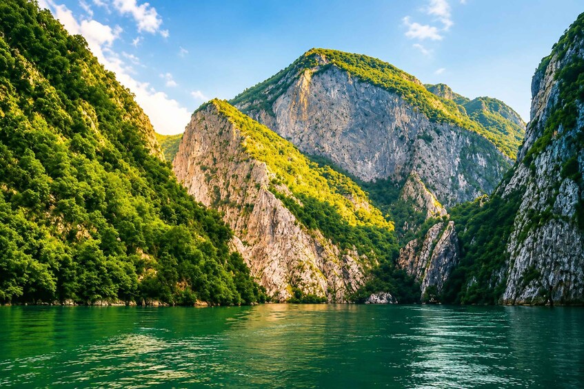 A mountainous landscape with a river. 4