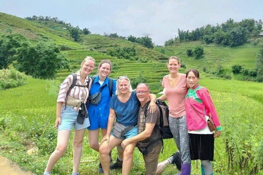 A group of people in a hilly, green landscape. 2