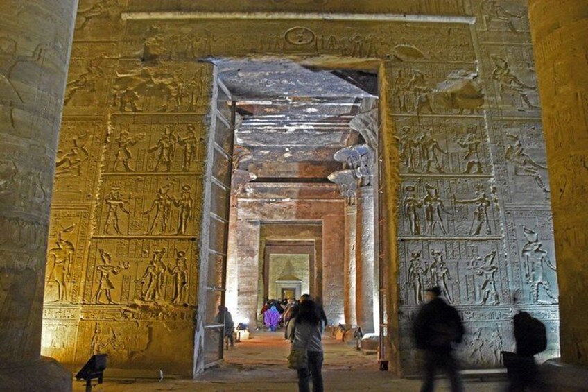 An ancient Egyptian temple with hieroglyphs and columns. 1