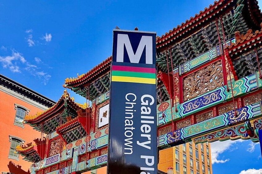 A traditional Chinese gate with colorful decorations and a sign for Gallery Place Chinatown. 1