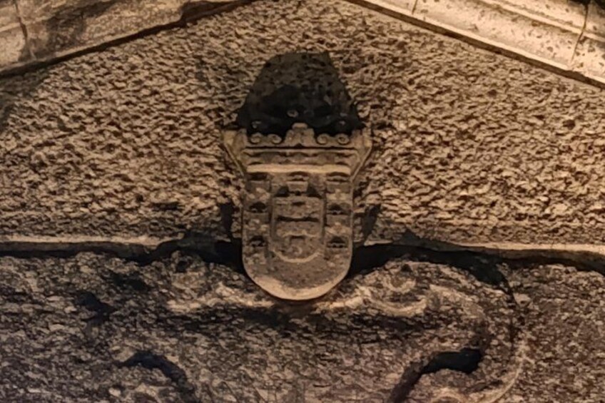 A shoe with a face design on a textured surface. 3