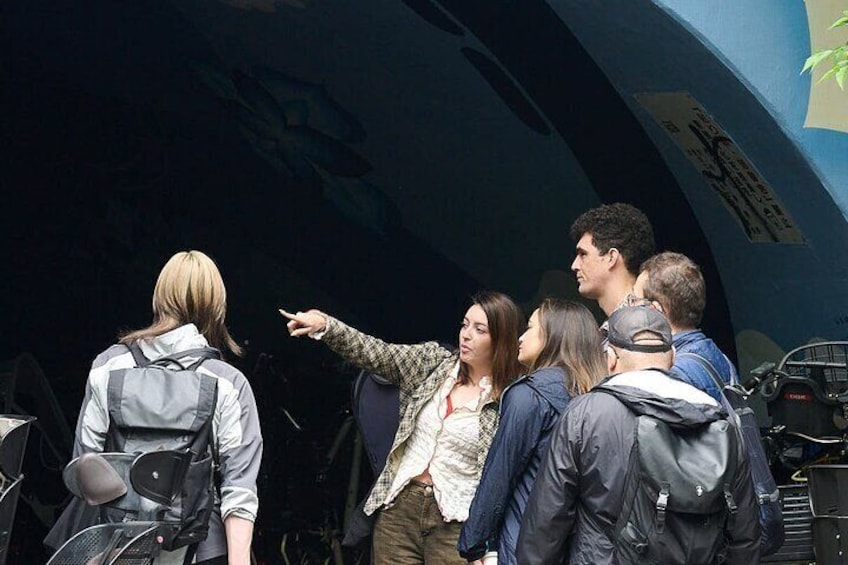 A group of people standing in front of a large aircraft. 3