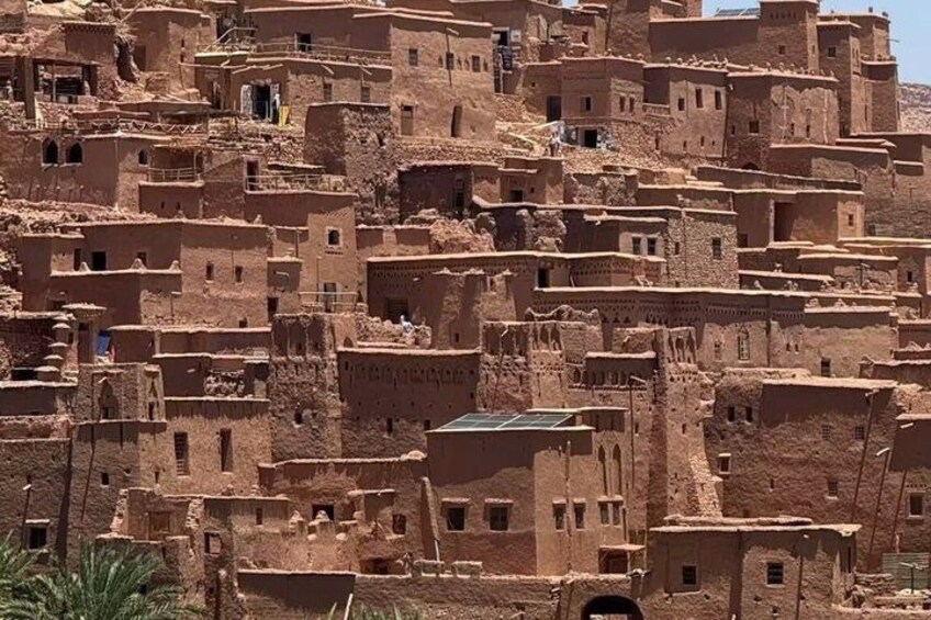 A densely packed village with traditional mud-brick buildings. 4