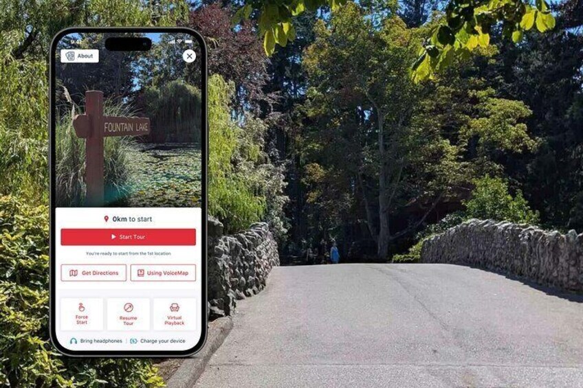A smartphone displaying a map with a crossroad sign and a message indicating the user is 0km to start a tour. 1