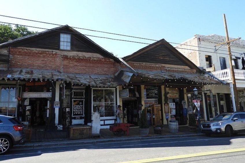 A rustic building with a sign reading 'Ghost Town.' 5