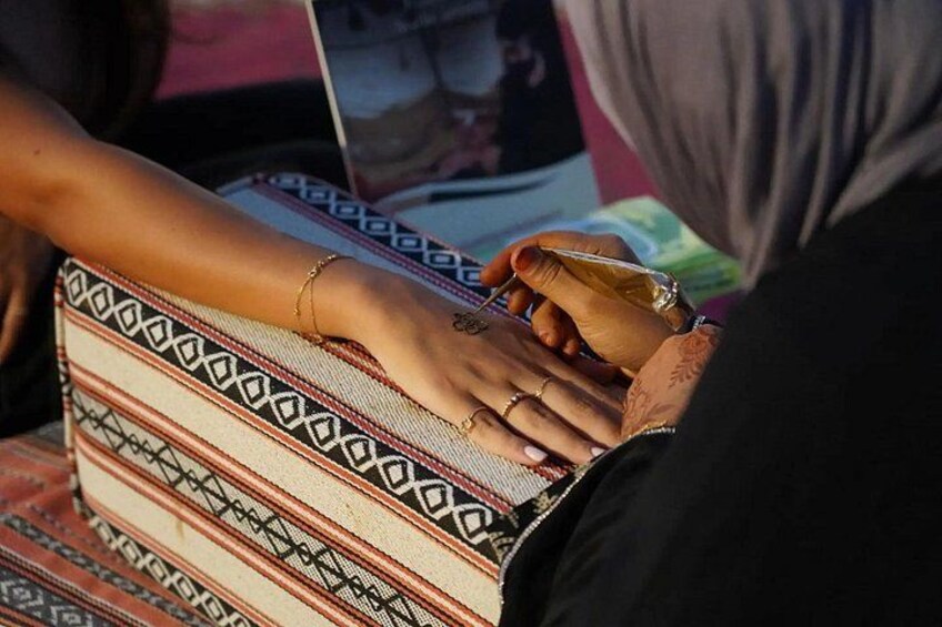 A person holding a patterned bag. 4