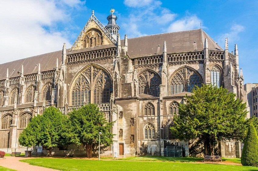 A large Gothic-style cathedral with intricate stonework and pointed arches. 3