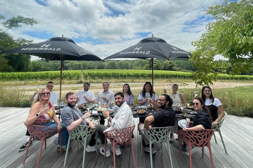 Enjoying a guided wine tasting overlooking the vineyard 4
