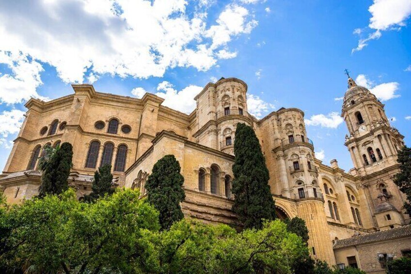 A historic cathedral with multiple towers and arched windows. 3