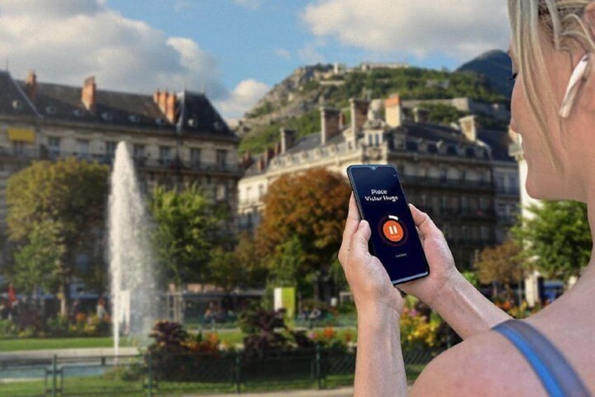 A person using a smartphone with a location-based app interface. 5
